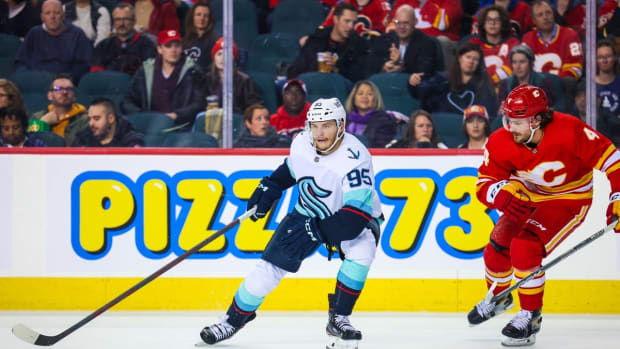Nov 1, 2022; Calgary, Alberta, CAN; Seattle Kraken left wing Andre Burakovsky (95) controls the puck against the Calgary Flames during the second period at Scotiabank Saddledome. Mandatory Credit: Sergei Belski-USA TODAY Sports